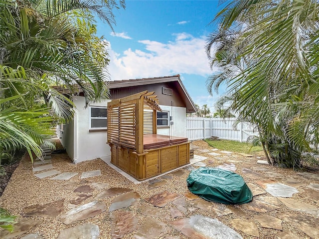 7125 S Shore Dr S, Saint Petersburg, FL 33707 - view of outbuilding featuring a hot tub and a fenced backyard