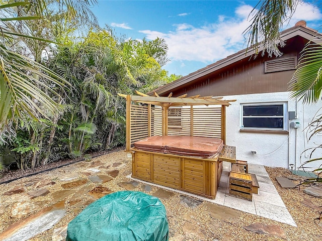 7125 S Shore Dr S, Saint Petersburg, FL 33707 - view of patio featuring a hot tub and a pergola