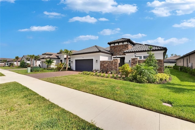 4795 Freccia Loop, Wesley Chapel, FL 33543 - mediterranean / spanish-style house with stucco siding, stone siding, driveway, an attached garage, and a front lawn