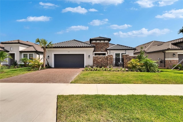 4795 Freccia Loop, Wesley Chapel, FL 33543 - mediterranean / spanish home featuring stucco siding, driveway, an attached garage, stone siding, and a tile roof