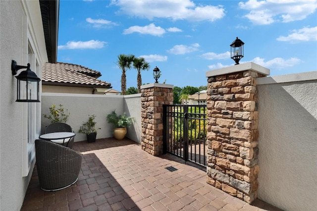 4795 Freccia Loop, Wesley Chapel, FL 33543 - view of patio with a gate