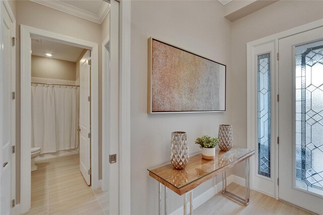 4795 Freccia Loop, Wesley Chapel, FL 33543 - entrance foyer featuring crown molding and baseboards