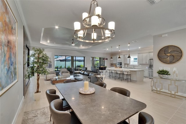 4795 Freccia Loop, Wesley Chapel, FL 33543 - dining area featuring crown molding, a ceiling fan, baseboards, a chandelier, and recessed lighting