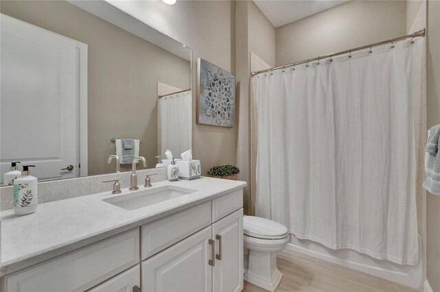 4795 Freccia Loop, Wesley Chapel, FL 33543 - bathroom featuring toilet, vanity, shower / bath combo, and tile patterned floors