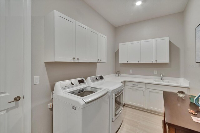 4795 Freccia Loop, Wesley Chapel, FL 33543 - washroom featuring washing machine and clothes dryer, cabinet space, and light tile patterned flooring