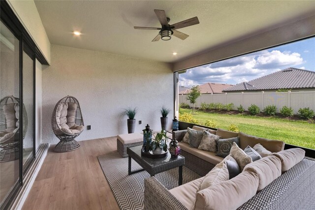 4795 Freccia Loop, Wesley Chapel, FL 33543 - sunroom featuring a ceiling fan and outdoor lounge area