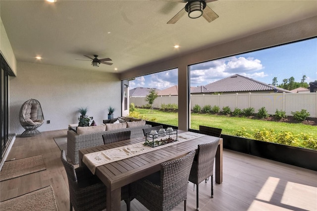4795 Freccia Loop, Wesley Chapel, FL 33543 - sunroom with ceiling fan, outdoor lounge area, and outdoor dining area