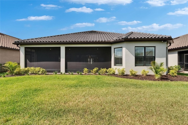 4795 Freccia Loop, Wesley Chapel, FL 33543 - back of property featuring a tiled roof, a lawn, stucco siding, and a garage