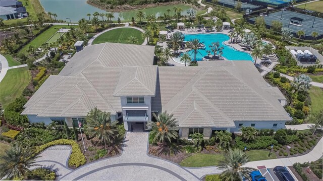 4795 Freccia Loop, Wesley Chapel, FL 33543 - aerial view of property and surrounding area featuring a pool area and a large body of water