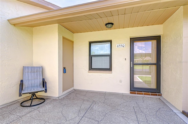 6550 Teak Ct, Zephyrhills, FL 33542 - property entrance featuring stucco siding