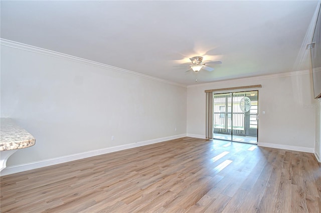 6550 Teak Ct, Zephyrhills, FL 33542 - empty room with ceiling fan, baseboards, light wood-style flooring, and crown molding