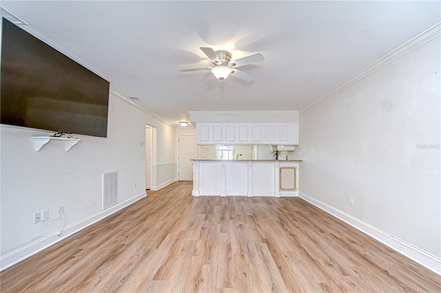 6550 Teak Ct, Zephyrhills, FL 33542 - unfurnished living room featuring ceiling fan, light wood-style flooring, baseboards, and crown molding