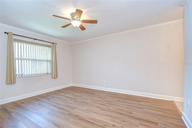 6550 Teak Ct, Zephyrhills, FL 33542 - spare room with light wood-style flooring, a ceiling fan, baseboards, and ornamental molding
