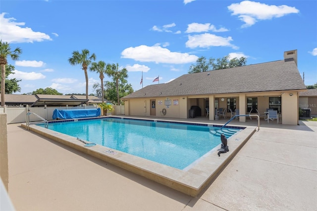 6550 Teak Ct, Zephyrhills, FL 33542 - community pool featuring a patio area and central air condition unit