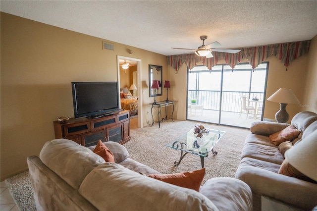1846 Golfview Dr Unit 1846, Tarpon Springs, FL 34689 - living room featuring ceiling fan, a textured ceiling, and carpet flooring