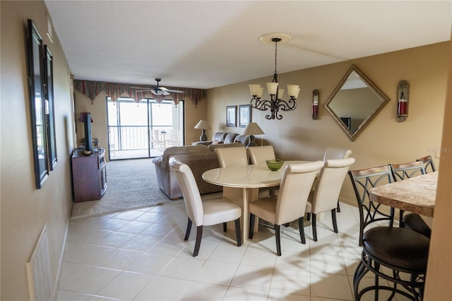 1846 Golfview Dr Unit 1846, Tarpon Springs, FL 34689 - dining area with a chandelier, light carpet, and light tile patterned floors