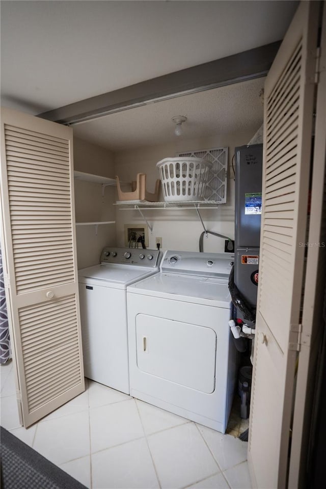 1846 Golfview Dr Unit 1846, Tarpon Springs, FL 34689 - laundry room featuring washer and dryer and light tile patterned floors
