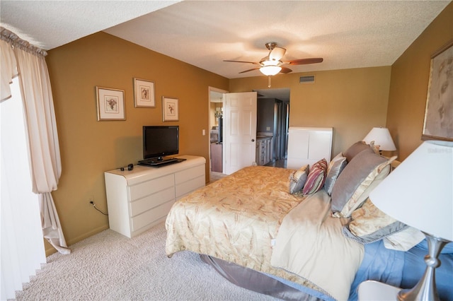 1846 Golfview Dr Unit 1846, Tarpon Springs, FL 34689 - bedroom with light colored carpet, a textured ceiling, ceiling fan, and baseboards