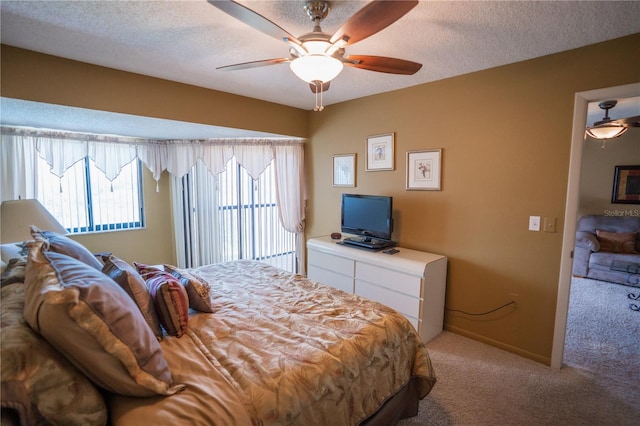 1846 Golfview Dr Unit 1846, Tarpon Springs, FL 34689 - bedroom featuring light carpet, a ceiling fan, access to exterior, and a textured ceiling