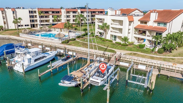 120 1st St E Unit 109, Tierra Verde, FL 33715 - dock area with boat lift, a water view, and view of marina