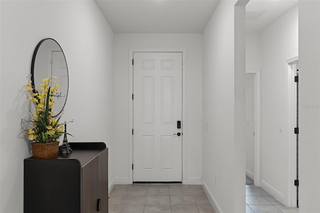 2296 Crossbow St, Clermont, FL 34715 - entryway featuring light tile patterned floors and baseboards