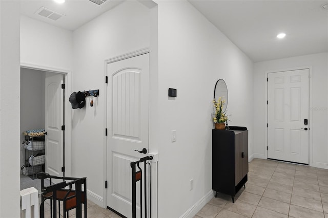 2296 Crossbow St, Clermont, FL 34715 - entrance foyer with light tile patterned floors, baseboards, and recessed lighting