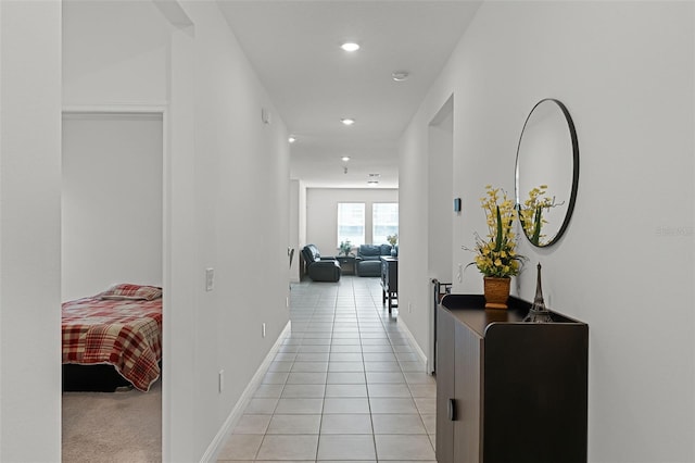 2296 Crossbow St, Clermont, FL 34715 - corridor featuring recessed lighting, light tile patterned flooring, and baseboards