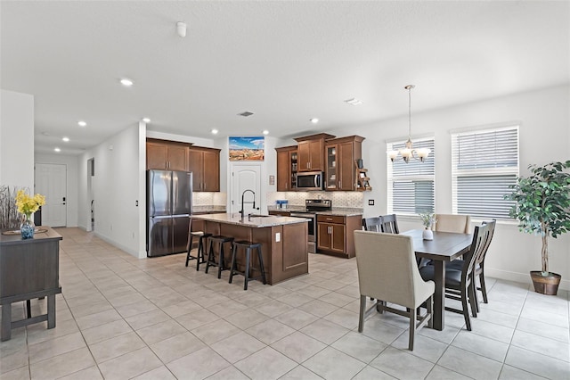 2296 Crossbow St, Clermont, FL 34715 - dining space featuring a chandelier, light tile patterned floors, recessed lighting, and baseboards