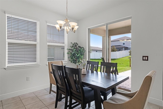 2296 Crossbow St, Clermont, FL 34715 - dining space featuring a chandelier, baseboards, and light tile patterned floors