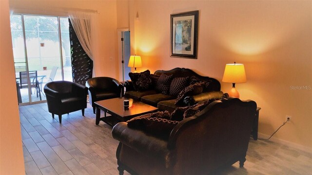 189 Minniehaha Cir, Haines City, FL 33844 - living area featuring wood finished floors