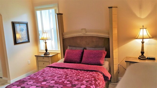 189 Minniehaha Cir, Haines City, FL 33844 - bedroom featuring multiple windows and baseboards