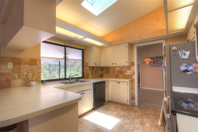 313 Oak Crest Dr, Safety Harbor, FL 34695 - kitchen featuring appliances with stainless steel finishes, a sink, backsplash, light countertops, and lofted ceiling
