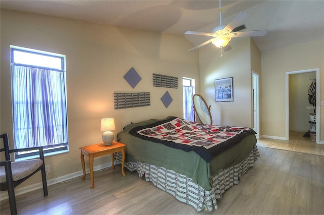313 Oak Crest Dr, Safety Harbor, FL 34695 - bedroom featuring wood finished floors, baseboards, and a ceiling fan