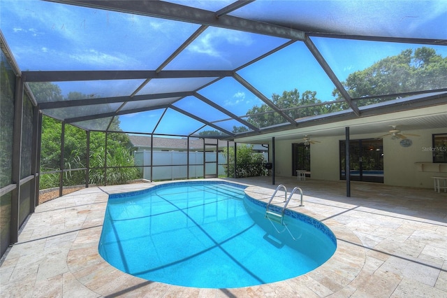 313 Oak Crest Dr, Safety Harbor, FL 34695 - view of swimming pool with a ceiling fan, a patio area, and glass enclosure