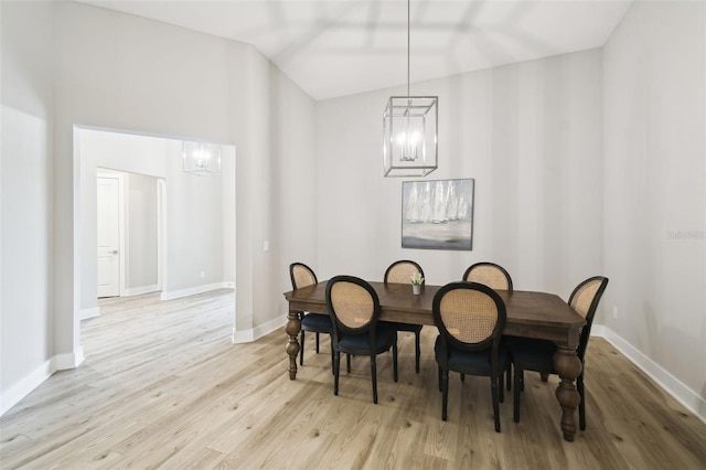 13334 Oldenburg Dr, Hudson, FL 34667 - dining space with a chandelier, light wood finished floors, and baseboards