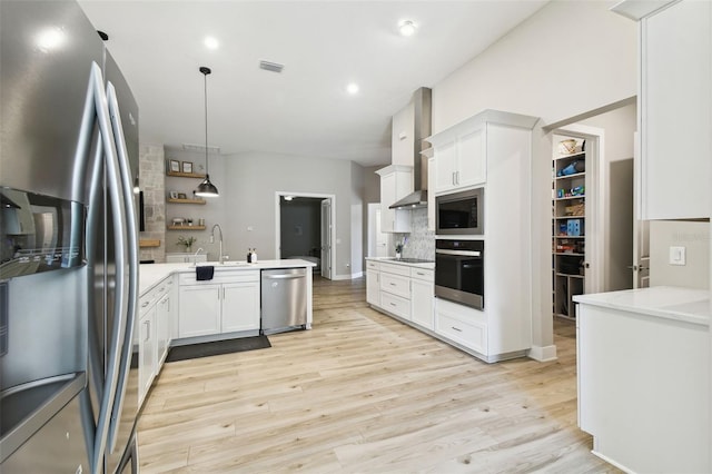 13334 Oldenburg Dr, Hudson, FL 34667 - kitchen featuring black appliances, decorative backsplash, white cabinets, light wood-style floors, and recessed lighting