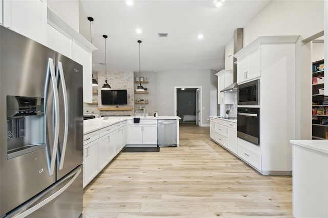 13334 Oldenburg Dr, Hudson, FL 34667 - kitchen featuring stainless steel appliances, a peninsula, decorative backsplash, light countertops, and white cabinets