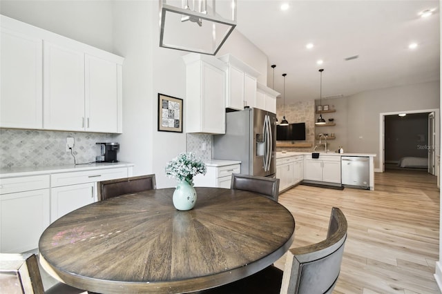 13334 Oldenburg Dr, Hudson, FL 34667 - dining room with light wood-style flooring and recessed lighting