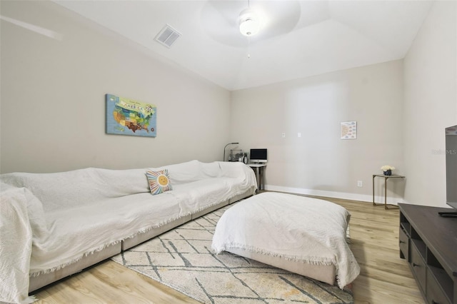 13334 Oldenburg Dr, Hudson, FL 34667 - bedroom with wood finished floors, lofted ceiling, ceiling fan, and baseboards