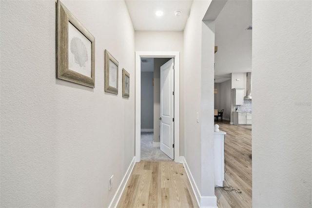 13334 Oldenburg Dr, Hudson, FL 34667 - corridor with light wood-type flooring