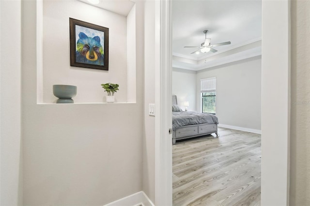 13334 Oldenburg Dr, Hudson, FL 34667 - bedroom with ornamental molding, wood finished floors, baseboards, and a ceiling fan
