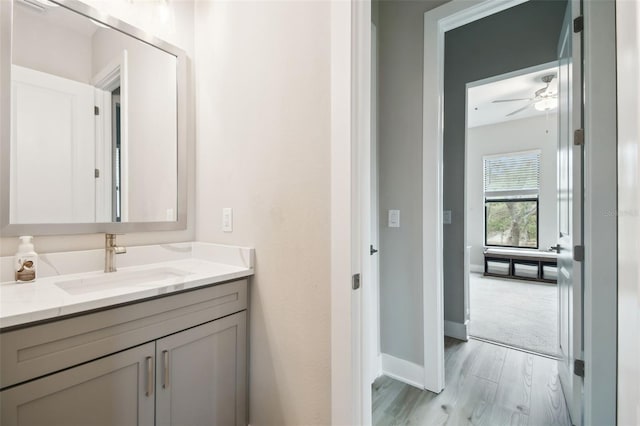 13334 Oldenburg Dr, Hudson, FL 34667 - bathroom featuring vanity, ceiling fan, and baseboards