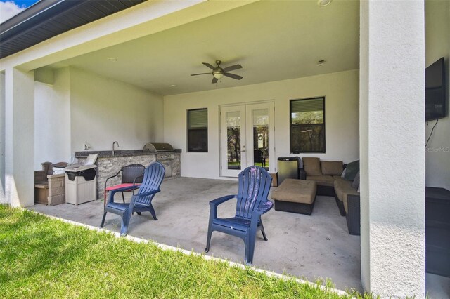 13334 Oldenburg Dr, Hudson, FL 34667 - view of patio / terrace featuring french doors, an outdoor kitchen, ceiling fan, and a sink