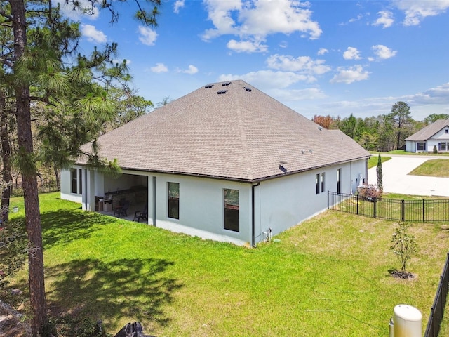 13334 Oldenburg Dr, Hudson, FL 34667 - rear view of property with stucco siding and roof with shingles