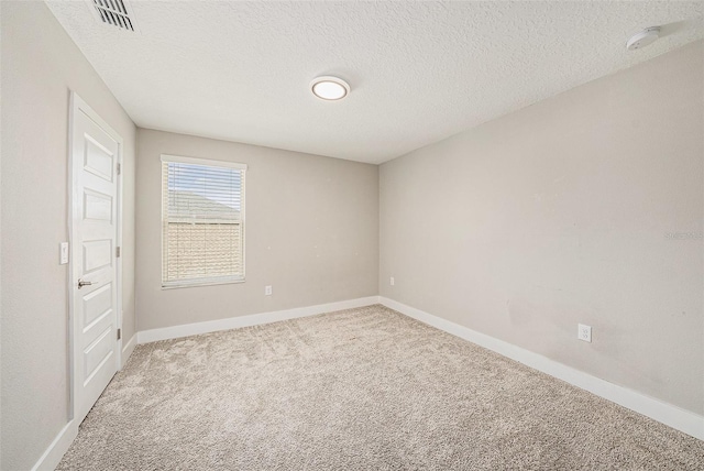 8719 Winning Fields Rd, New Port Richey, FL 34655 - spare room featuring carpet floors, a textured ceiling, baseboards, and a smoke detector