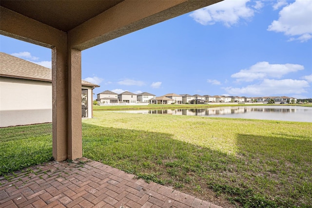 8719 Winning Fields Rd, New Port Richey, FL 34655 - view of grassy yard with a residential view and a water view