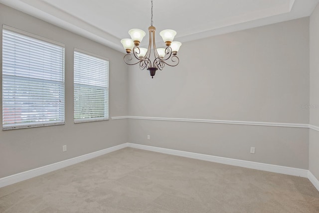 16137 Churchview Dr, Lithia, FL 33547 - empty room featuring a chandelier, light carpet, and baseboards
