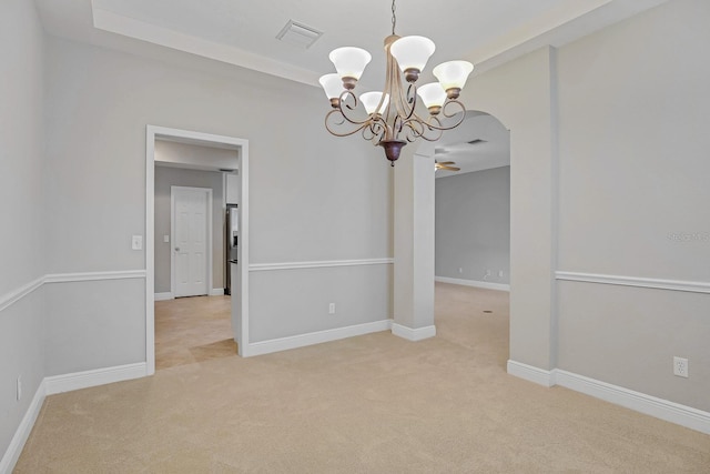 16137 Churchview Dr, Lithia, FL 33547 - empty room with a chandelier, light colored carpet, arched walkways, and baseboards