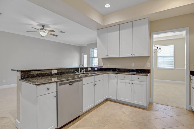 16137 Churchview Dr, Lithia, FL 33547 - kitchen with dishwasher, a sink, light carpet, a peninsula, and dark stone counters