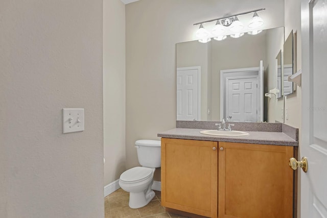 16137 Churchview Dr, Lithia, FL 33547 - bathroom featuring toilet, vanity, tile patterned floors, and baseboards